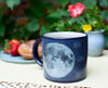 Product photo of Moon Heat-Changing Mug, a novelty gift manufactured by The Unemployed Philosophers Guild.