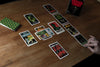 Image of the deck with 10 card designs laid out on the table.