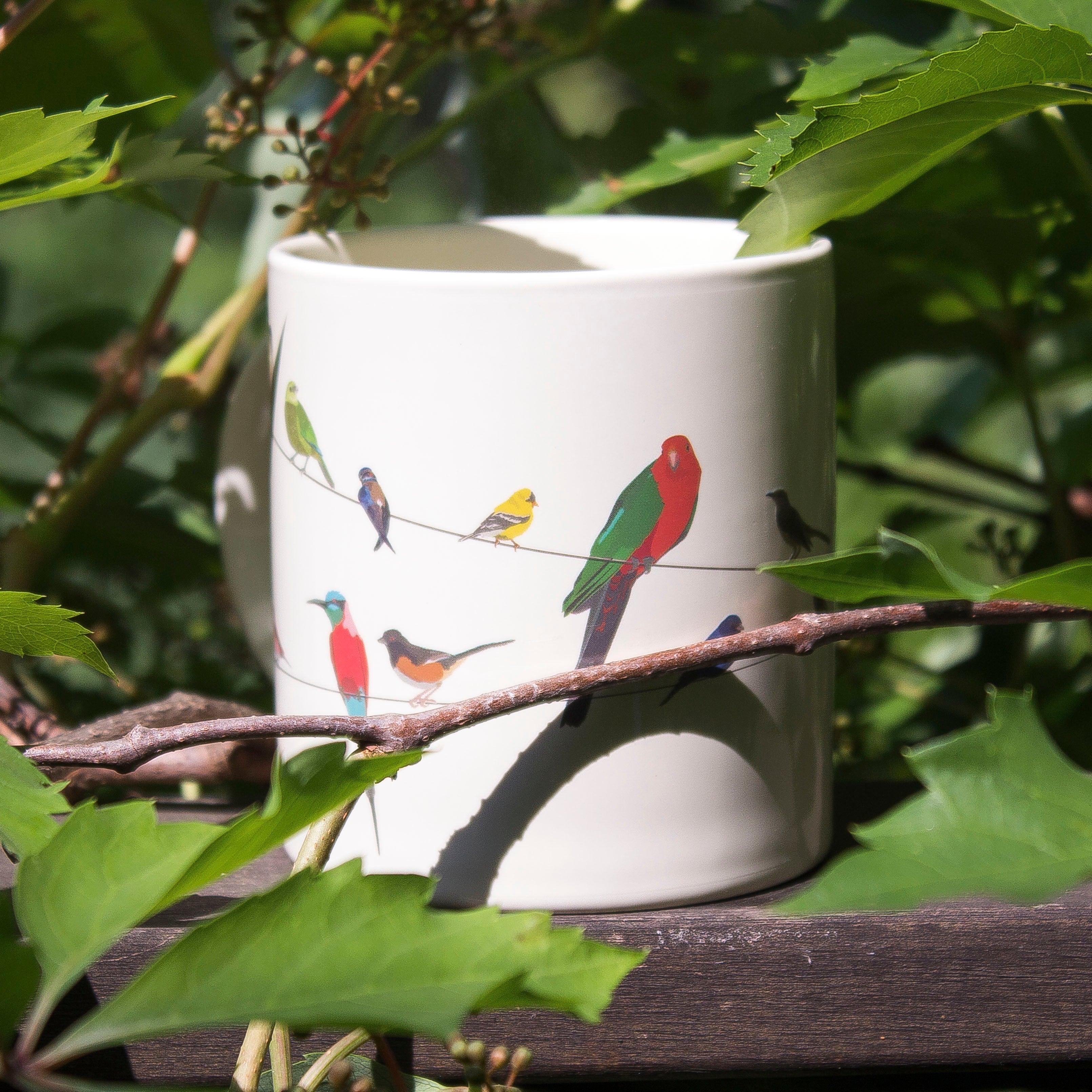 Product photo of Birds on a Wire Heat-Changing Mug, a novelty gift manufactured by The Unemployed Philosophers Guild.