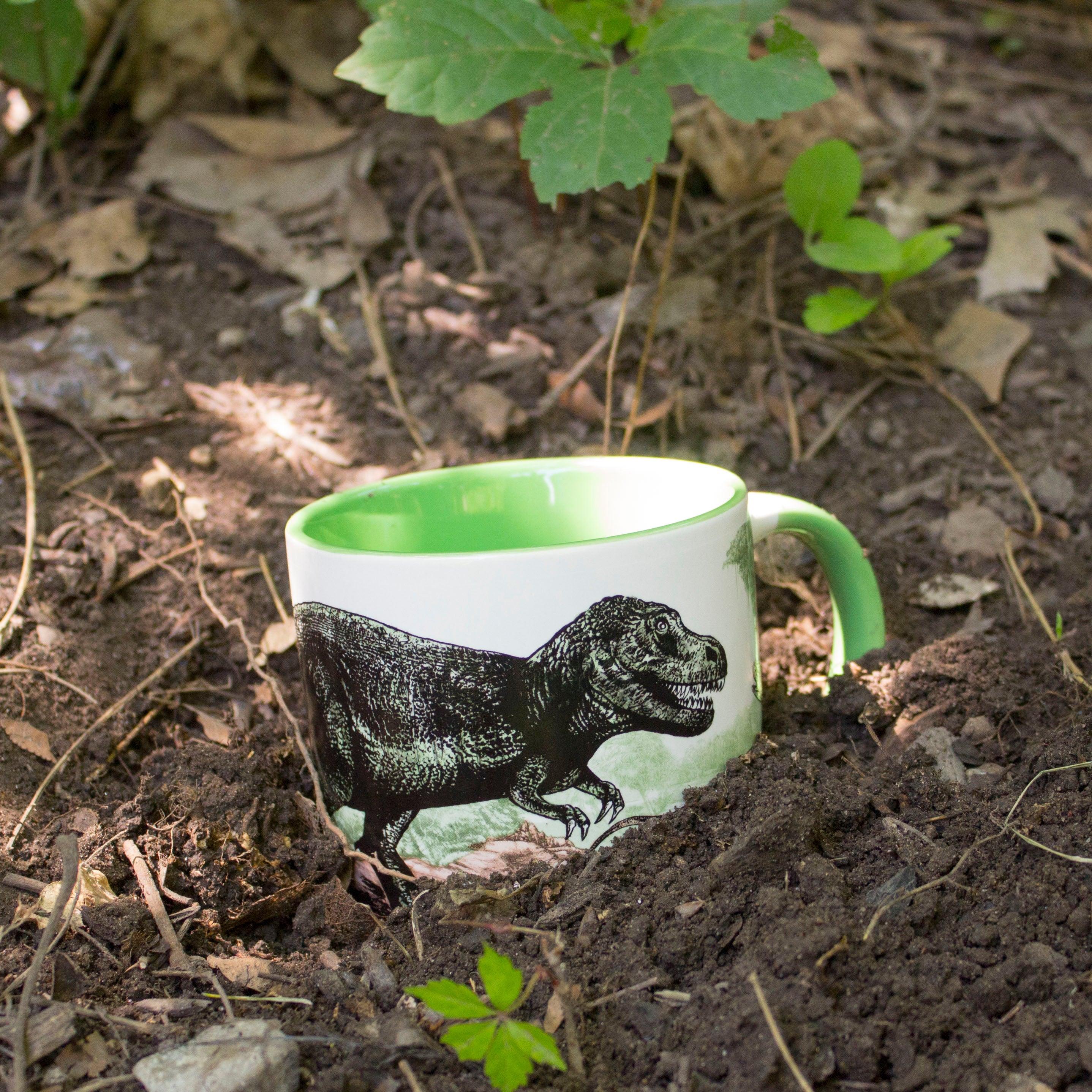 Product photo of Dinosaur Heat-Changing Mug, a novelty gift manufactured by The Unemployed Philosophers Guild.