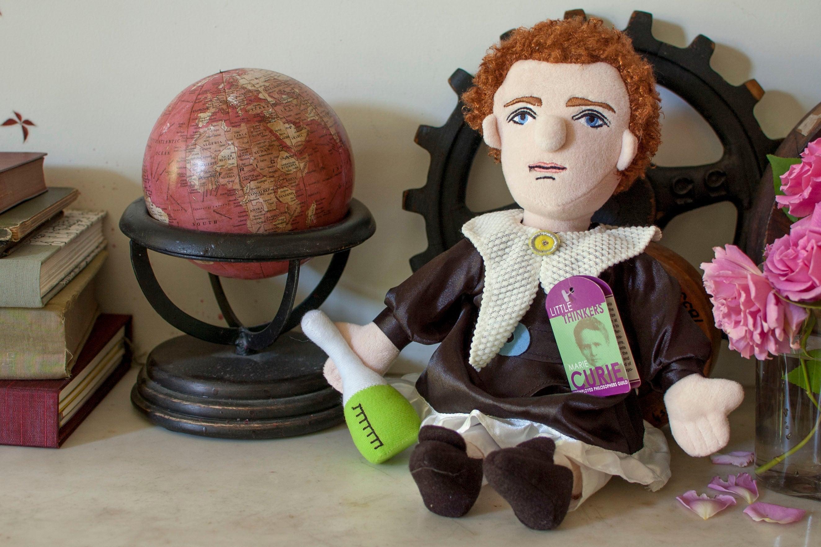 Product photo of Marie Curie Plush Doll, a novelty gift manufactured by The Unemployed Philosophers Guild.