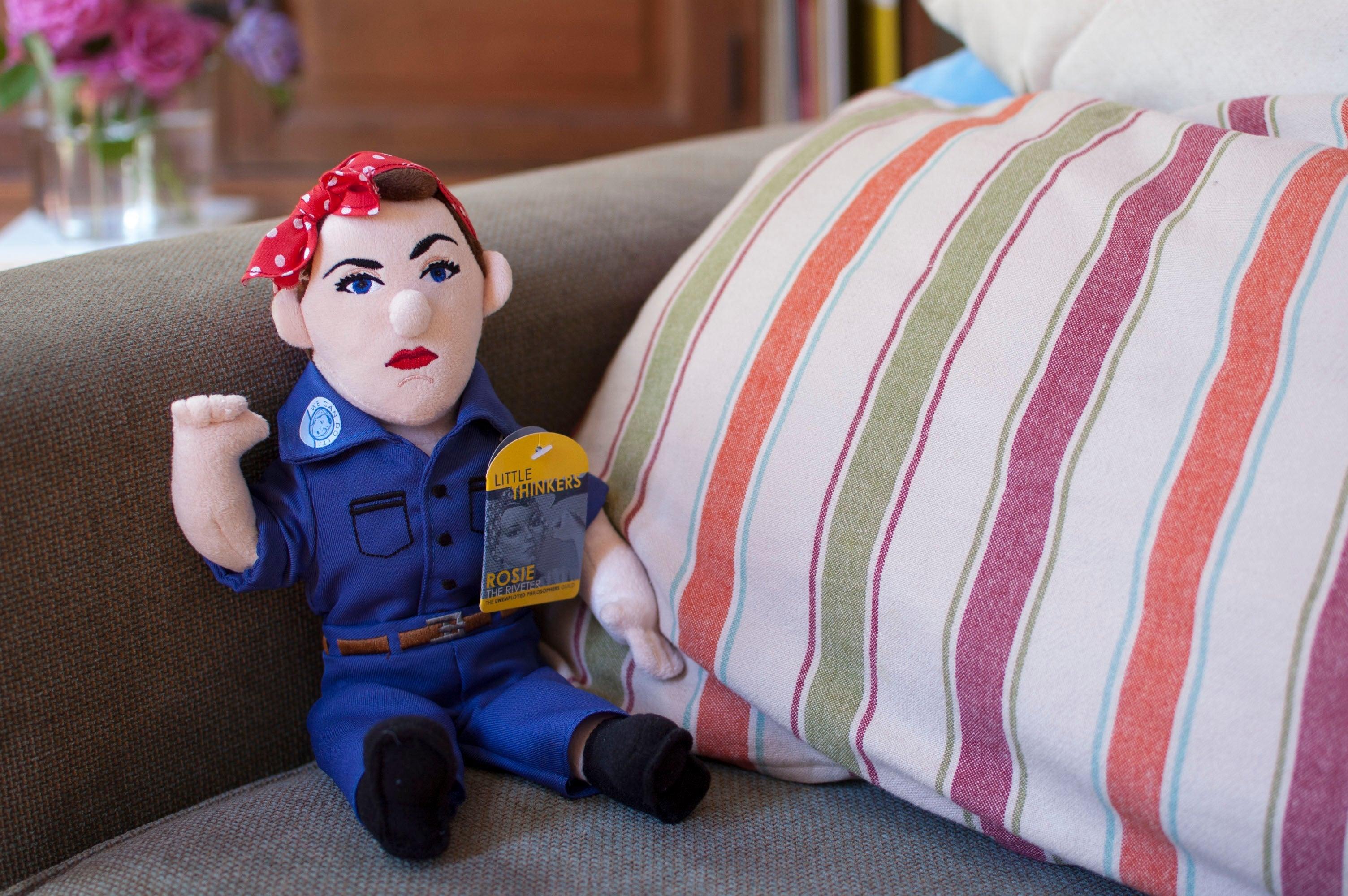 Product photo of Rosie the Riveter Plush Doll, a novelty gift manufactured by The Unemployed Philosophers Guild.