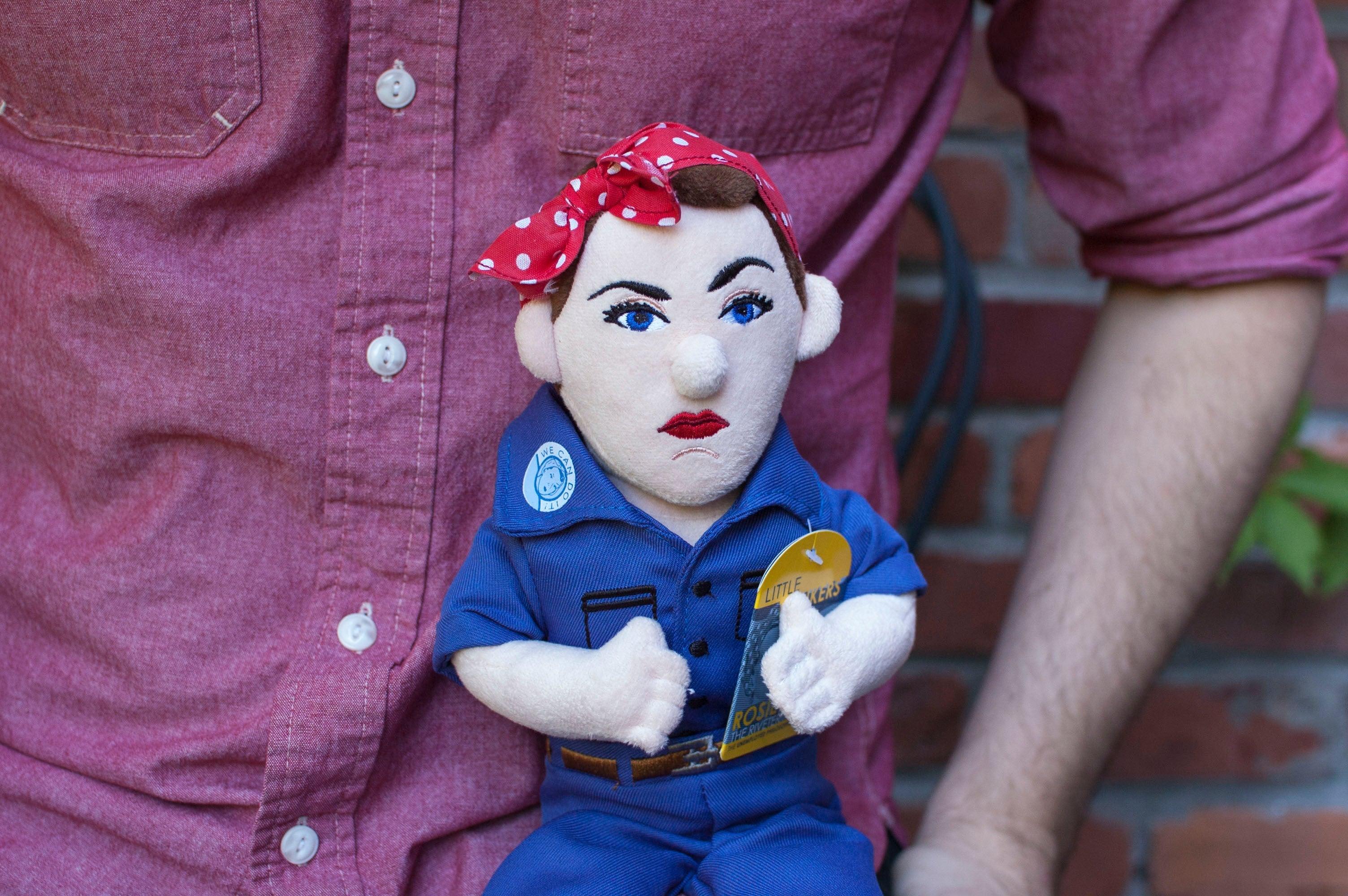 Product photo of Rosie the Riveter Plush Doll, a novelty gift manufactured by The Unemployed Philosophers Guild.