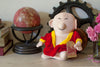 Product photo of Sitting Buddha Plush Doll, a novelty gift manufactured by The Unemployed Philosophers Guild.